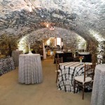 The catacombs at Excelsior were dressed for a “guy” party in plaids and gray tones by Special Occasions. Strategic lighting added drama to the unique space. (Photo credit: Adam Sinners)