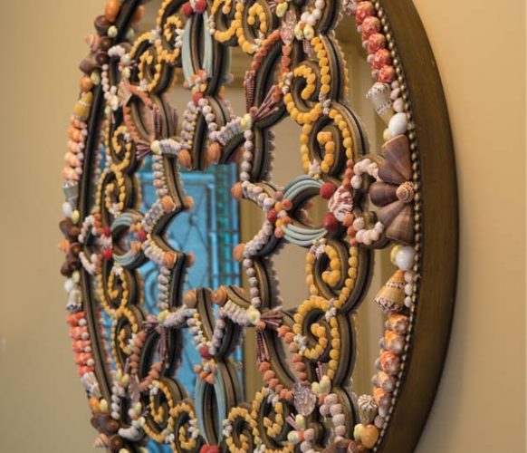 Shells from the Philippines were used to decorate this mirror.