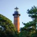 The Currituck Beach Lighthouse went into service on December 1, 1875, allowing for the coastline to be illuminated between Cape Henry, Virginia, and Bodie Island, North Carolina. The bricks used to build it were left their natural red color so that ships could distinguish it from the other lighthouses. The park-like setting has made the lighthouse a popular site for destination weddings.